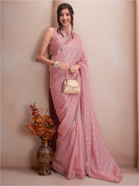 Baby Pink handwoven linen saree with silver tissue mirror work border
